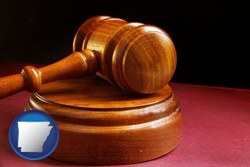 an arbitrator's wooden gavel - with Arkansas icon