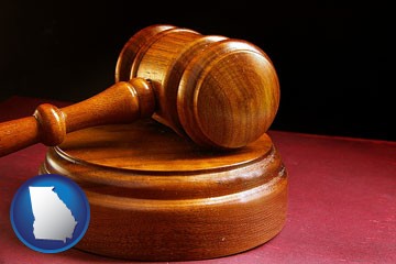 an arbitrator's wooden gavel - with Georgia icon