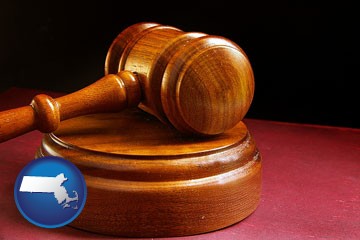 an arbitrator's wooden gavel - with Massachusetts icon