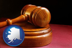 alaska map icon and an arbitrator's wooden gavel