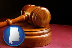 alabama map icon and an arbitrator's wooden gavel