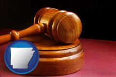 arkansas map icon and an arbitrator's wooden gavel