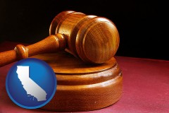 california map icon and an arbitrator's wooden gavel