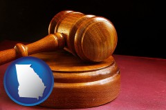 georgia map icon and an arbitrator's wooden gavel