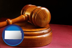 kansas map icon and an arbitrator's wooden gavel