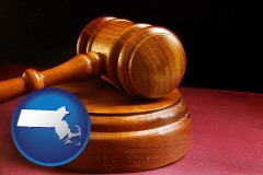 massachusetts map icon and an arbitrator's wooden gavel