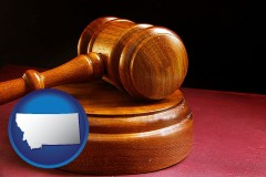 montana map icon and an arbitrator's wooden gavel