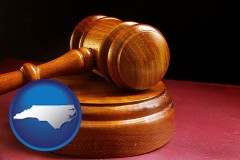 north-carolina map icon and an arbitrator's wooden gavel
