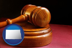 north-dakota map icon and an arbitrator's wooden gavel