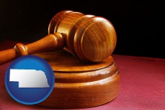 nebraska map icon and an arbitrator's wooden gavel