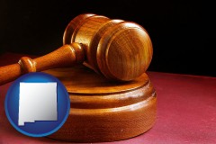 new-mexico map icon and an arbitrator's wooden gavel