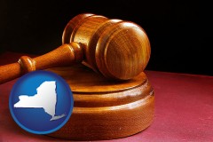 new-york map icon and an arbitrator's wooden gavel