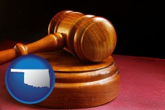 oklahoma map icon and an arbitrator's wooden gavel