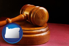 oregon map icon and an arbitrator's wooden gavel