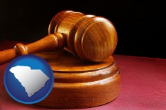 south-carolina map icon and an arbitrator's wooden gavel