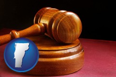 vermont map icon and an arbitrator's wooden gavel